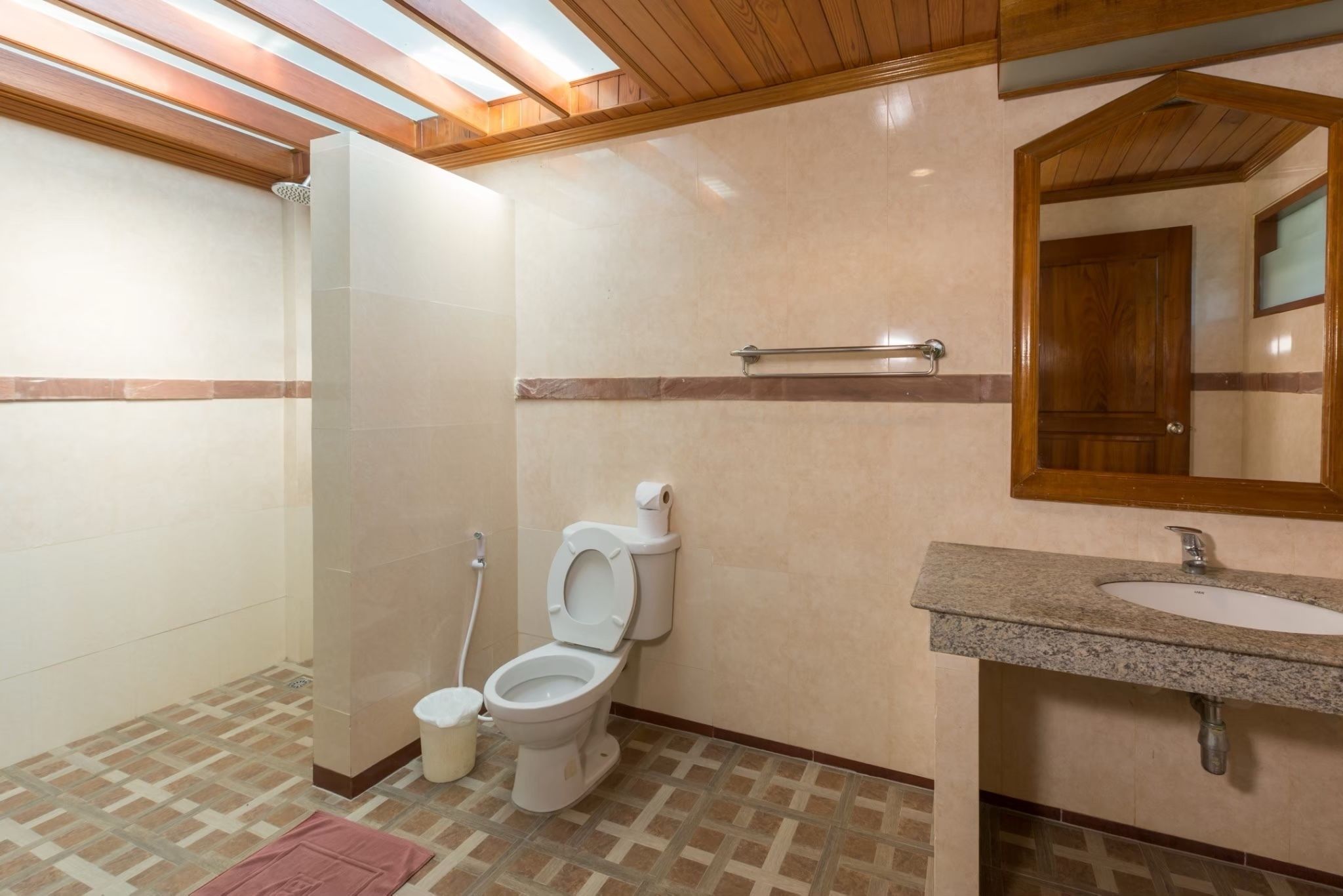 deluxe bungalow | bathroom | shower, towels, soap, shampoo