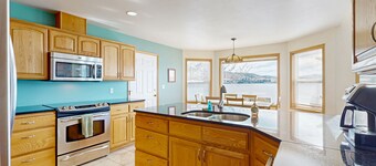 Sunny, lakefront home with huge patio, floating dock & 2 buoys