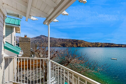 Sunny, lakefront home with huge patio, floating dock & 2 buoys