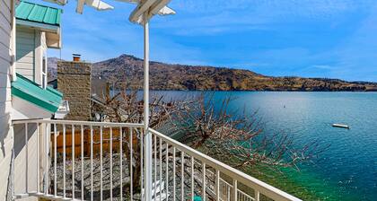 Sunny, lakefront home with huge patio, floating dock & 2 buoys