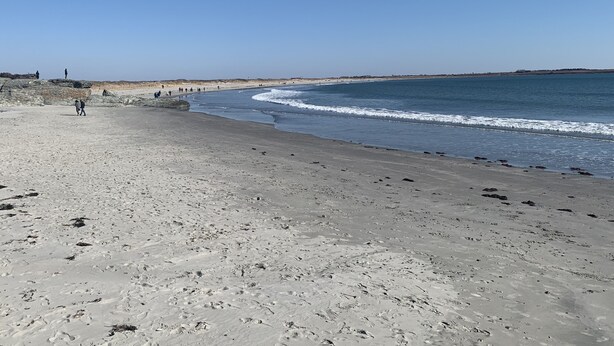 A beach with clear skies, sandy shore, and footprints. - Location!! Ocean views. Easy walk to beaches, restaurants, shops. Quiet street.  (Middletown)