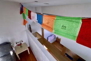 Primary bedroom. Private from below; can peer over wall down to living room.