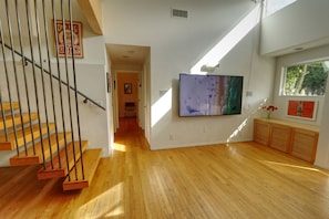 Living room. View down hallway to laundry room, bathroom, bedrooms.