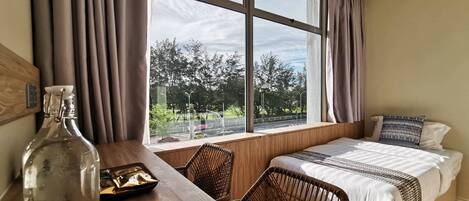 Deluxe Family Room with Golf View | Premium bedding, memory-foam beds, desk, soundproofing