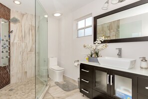 Shower, hair dryer, towels, toilet paper