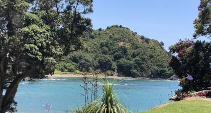 Private beach log cabin with boat ramp on 60 acre coastal property