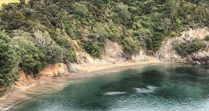 Private beach log cabin with boat ramp on 60 acre coastal property