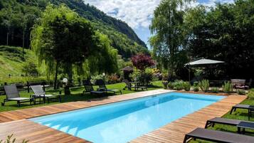 Seasonal outdoor pool, open 9:30 AM to 7:00 PM, sun loungers
