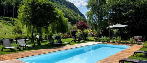 Seasonal outdoor pool, open 9:30 AM to 7:00 PM, sun loungers