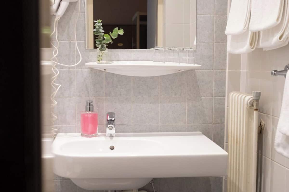 quadruple room | bathroom | hair dryer, towels, soap, shampoo