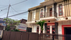 A two-story building with a sign for 'Rumah Tua' indicating it is a guest house. - Rumah Tawa Guesthouse 1 (Bandung)