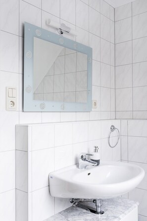 Combined shower/tub, hair dryer, towels, toilet paper