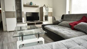 Comfort Condo, City View | Living area | 55-inch flat-screen TV with satellite channels, Smart TV