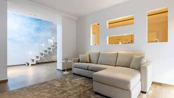 Suite Standard | Area soggiorno | TV a schermo piatto