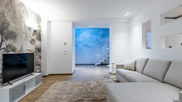 Suite Standard | Area soggiorno | TV a schermo piatto