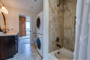 Bathtub, hair dryer, towels