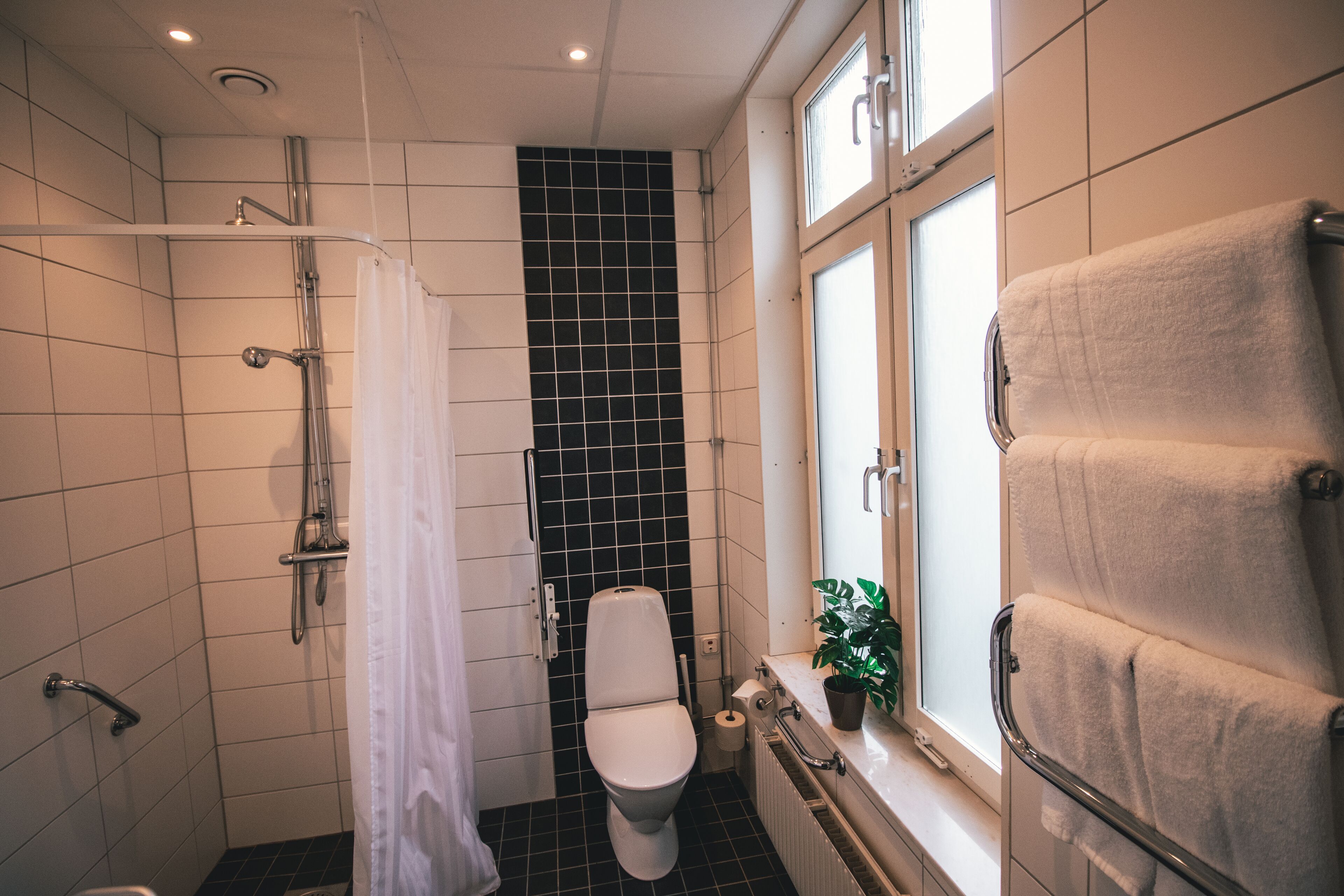 standard double room | bathroom | designer toiletries, hair dryer, towels, soap