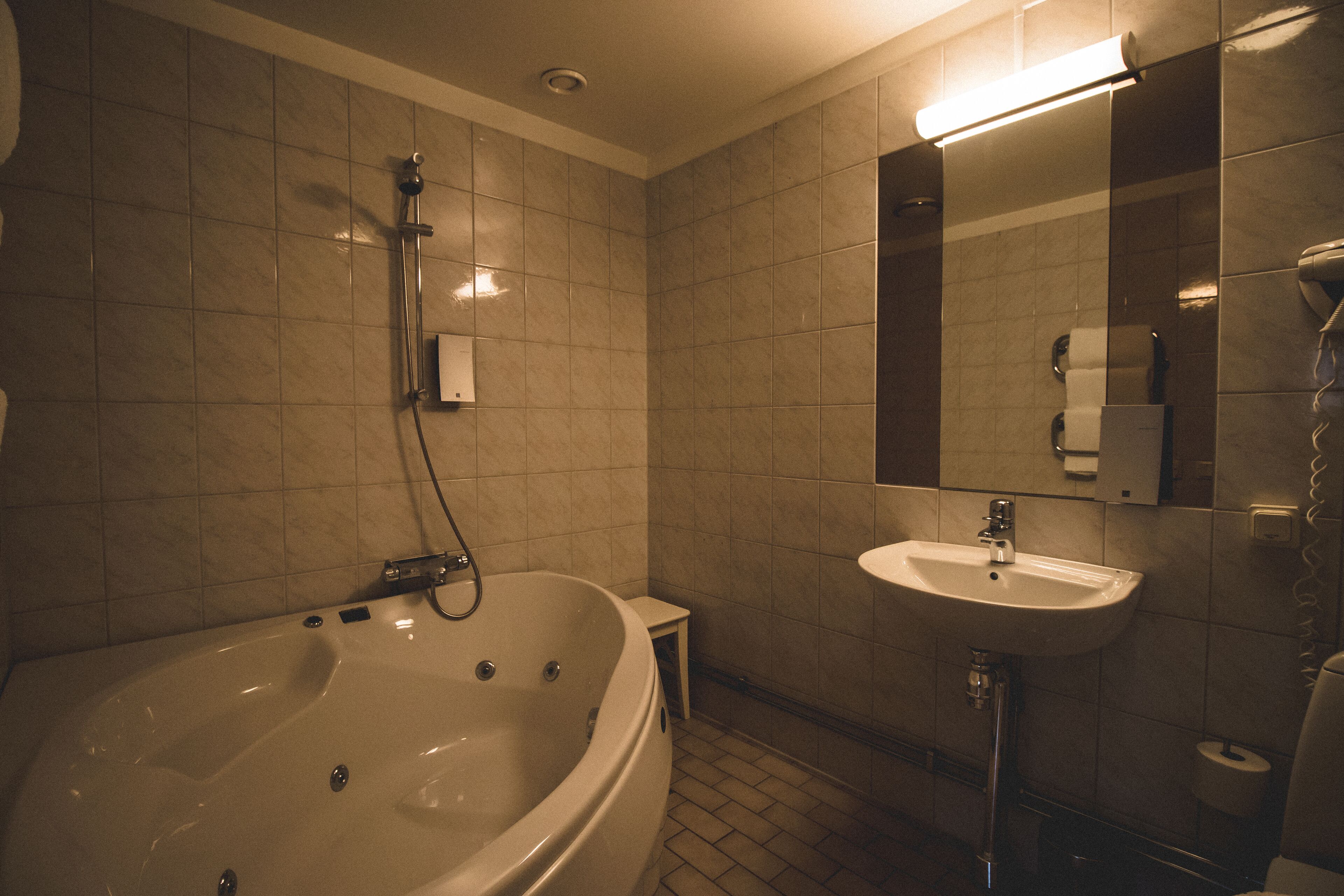 standard suite | bathroom | designer toiletries, hair dryer, towels, soap