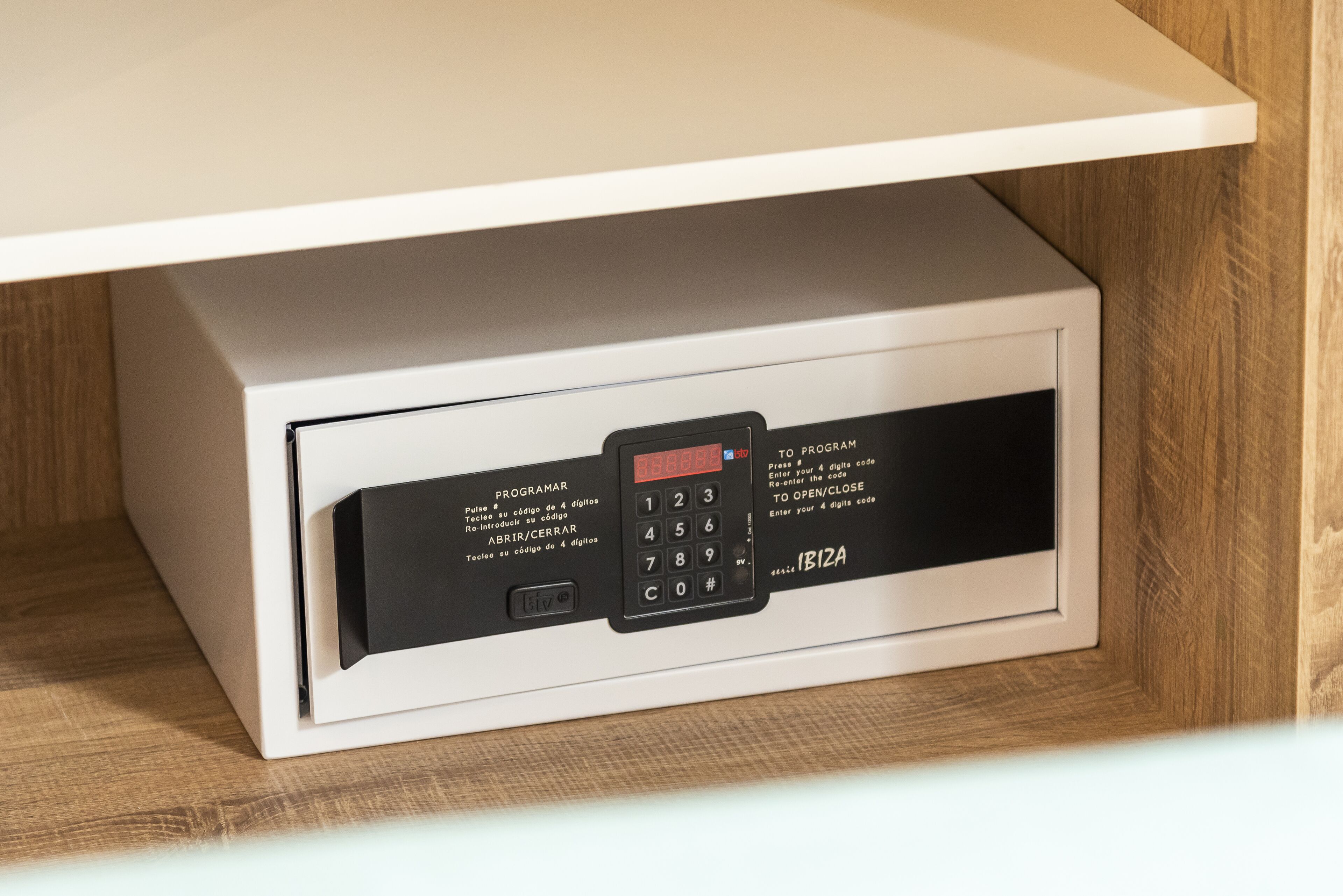 A white safe with a digital keypad and a small screen, labeled "PROGRAM" and "IBIZA".