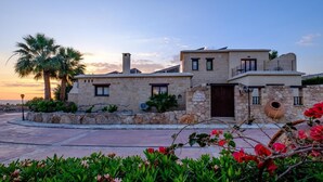 A stone villa with a balcony, a chimney, and a sign that reads "Villa Lamberti". - Villa Anemona (Pegeia)