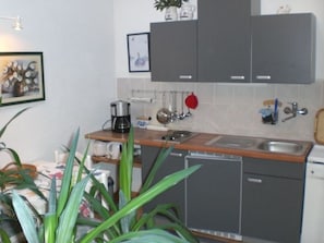 Fridge, coffee/tea maker, electric kettle, toaster