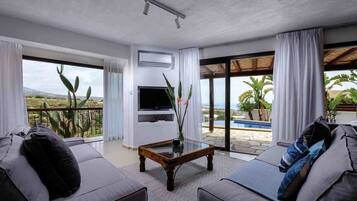 Villa | Living area | Flat-screen TV, DVD player
