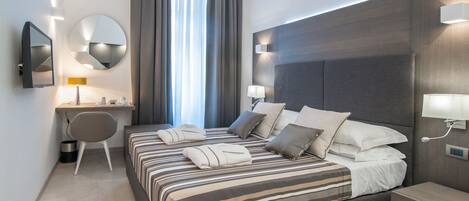 Memory-foam beds, minibar, in-room safe, desk