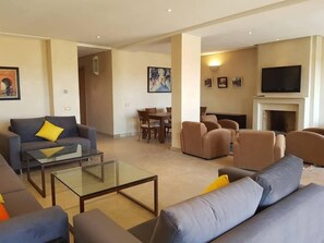 Luxury Villa | Living area | 45-inch flat-screen TV with satellite channels, TV, fireplace - Villa Prestige (Marrakech)