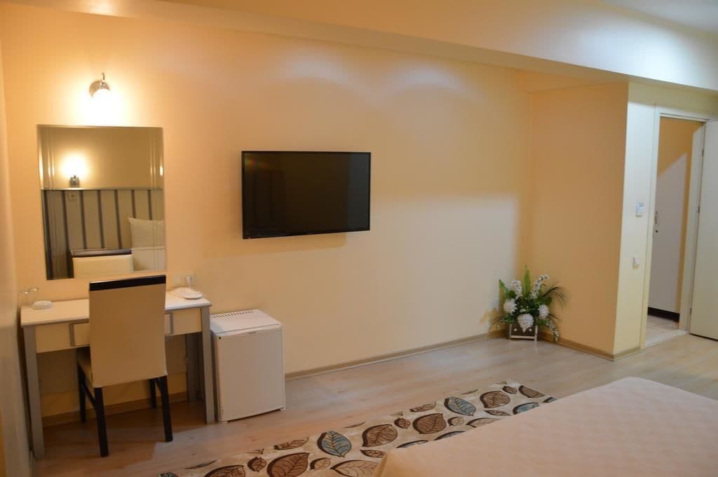 deluxe double room | living area | lcd tv