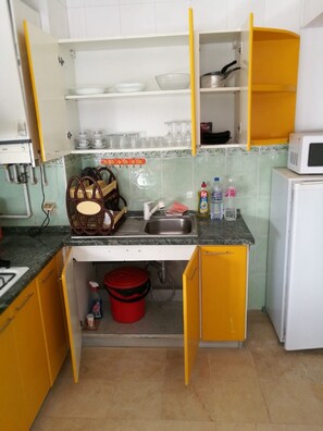 Fridge, microwave, cookware/dishes/utensils