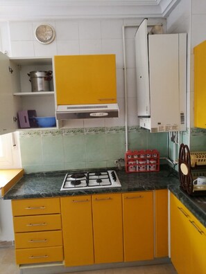 Fridge, microwave, cookware/dishes/utensils