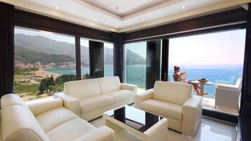 Deluxe Apartment, 2 Bedrooms | Living area | Flat-screen TV
