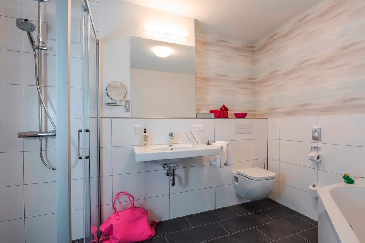 family studio | bathroom | hair dryer, slippers, heated floors, towels
