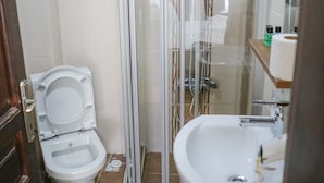 A bathroom with a toilet, a shower enclosure, and a sink. - My Way Teras Butik Otel (Adalar)