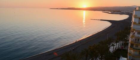 On the beach, sun loungers