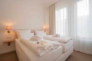 Unclassified image, 3 of 12, button - Standard double room - Logierhaus Austernfischer (Norderney)