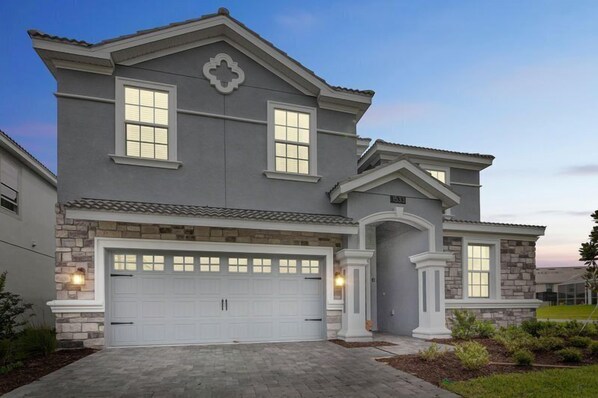 House | Front of property – evening/night - 9BR 5BA ChampionsGate Pool Home (Davenport)