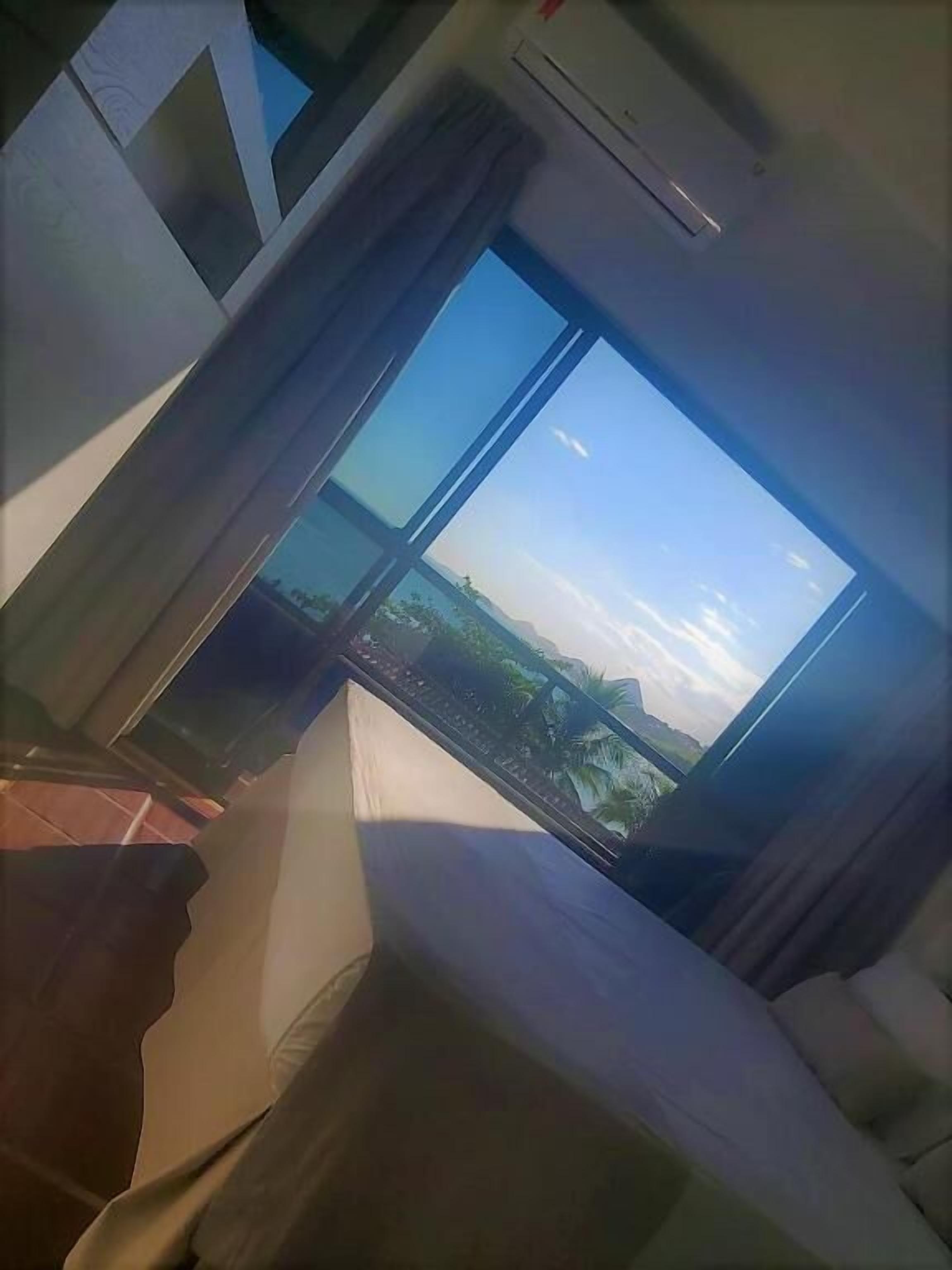 family room, balcony, partial sea view | view from room