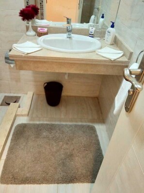 Shower, hair dryer, bathrobes, towels