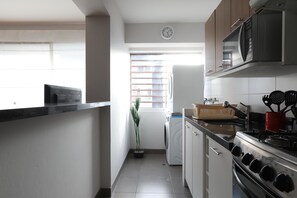 Apartment, 2 Bedrooms | Private kitchen | Full-size fridge, microwave, oven, stovetop