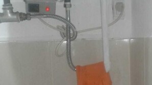 A kitchen with a sink, faucet, and a dish soap bottle. - Zona Peatonal Central Apartment Mendoza City (Mendoza)