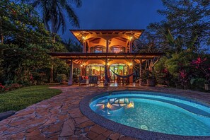 A two-story building with a pool, surrounded by tropical vegetation. - Jungle Dream- Magnificent Getaway with Ocean-Mountain Views (Savegre)