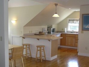 Enjoy cooking in this well-equipped kitchen with a central island and sink.