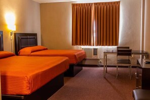 A hotel room with two beds, a desk, a chair, and an air conditioning unit. - BONITTO INN Tampico Lomas (Tampico)