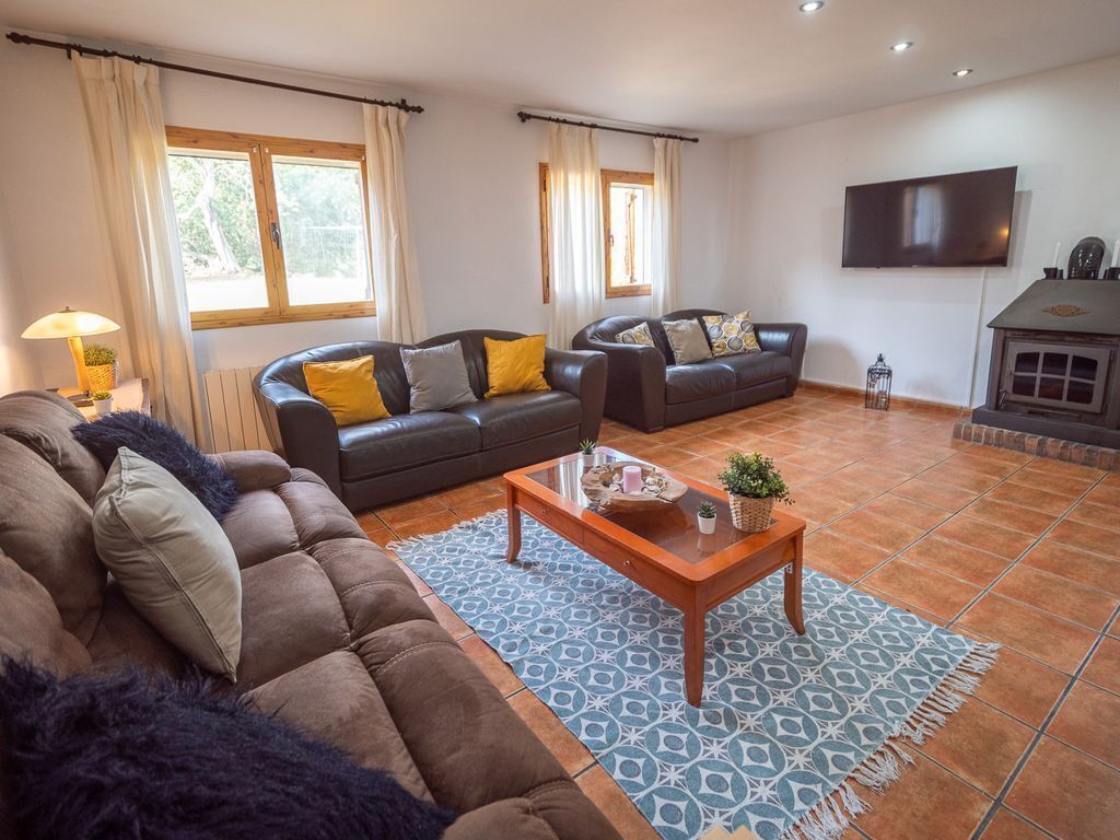 A living room with two sofas, a coffee table, and a TV.