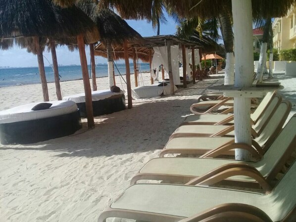 On the beach, sun loungers
