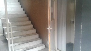 A staircase with white steps leading to a door. - Central Apartment Mendoza City (Mendoza)