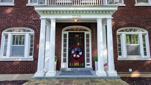 A brick building with a white porch, a door with a wreath, and the year 2026 displayed above. - Hot tub, Highlands-Restaurant Row Churchill Downs, Zoo, Bellarmine, Downtown (Louisville)