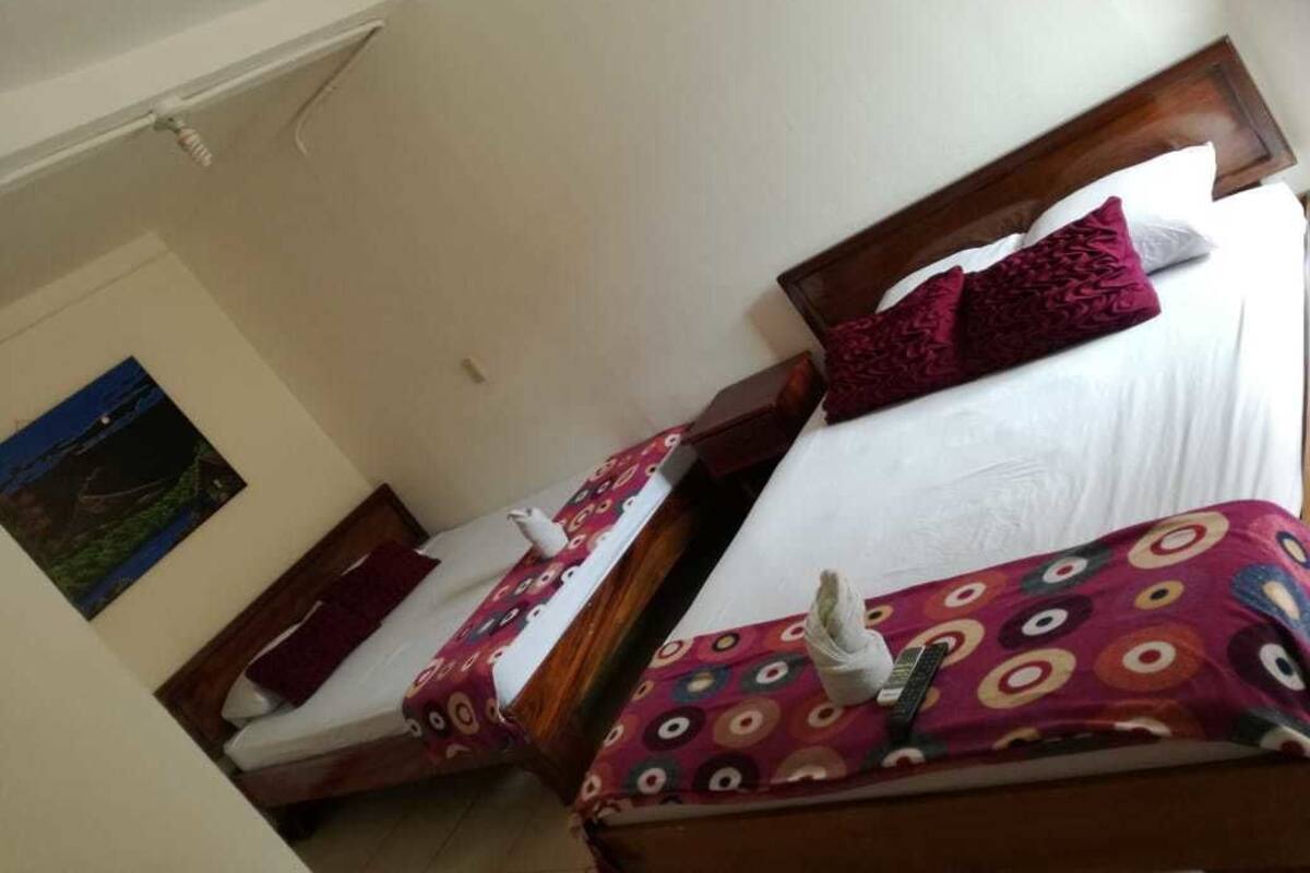 Quadruple Room, Pool View | Minibar, WiFi (free), bed sheets