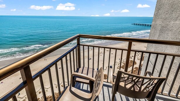 A balcony with a view of the ocean and beach. - Updated Oceanfront 16th floor w/ Amazing Views! (Myrtle Beach)